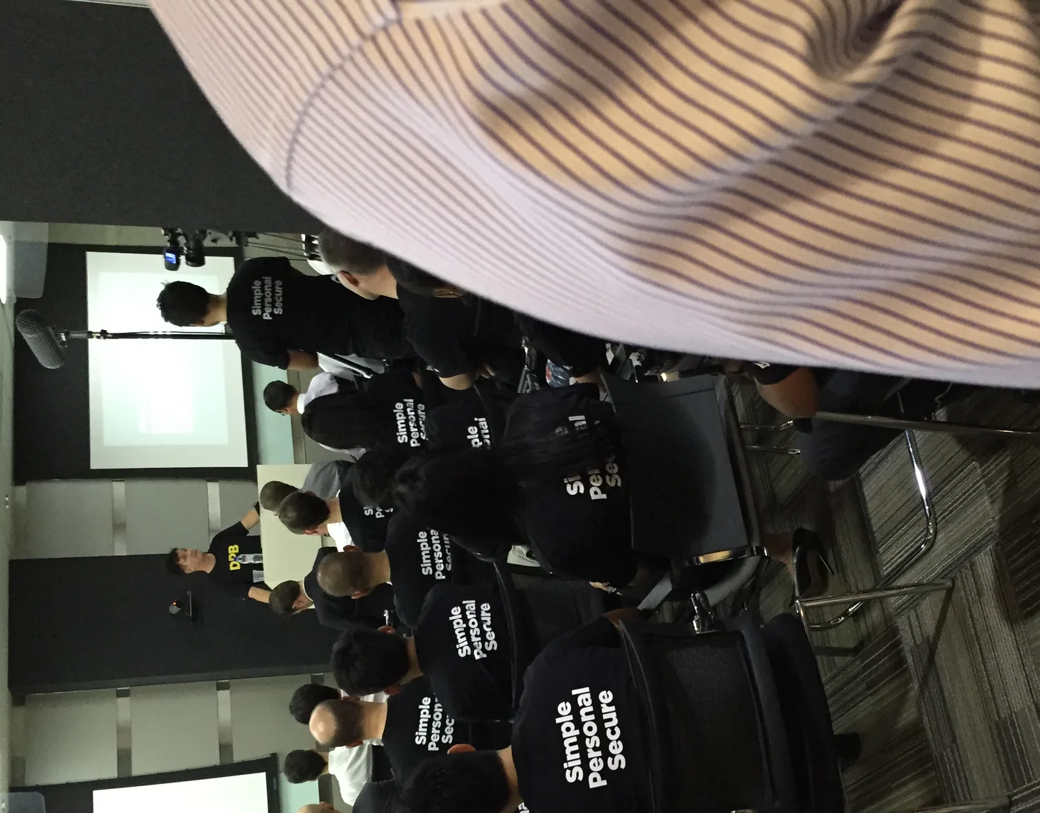 Platform launch event in Singapore, the team wearing shirts reading simple, personal, secure